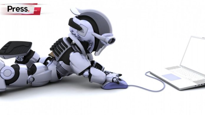 A tiny, sleek robot is lying on the ground. It is holding a computer mouse in one hand and is using the computer, symbolizing technical SEO.