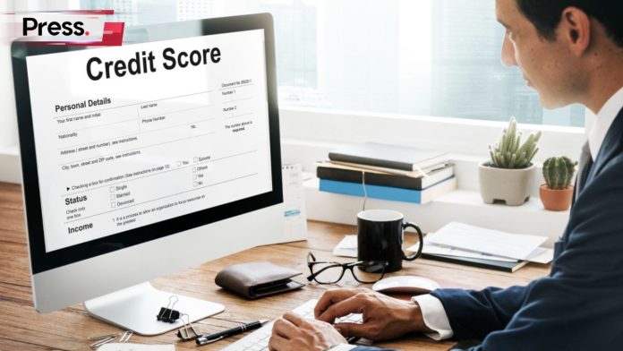 A businessman checks his CCRIS report on a PC