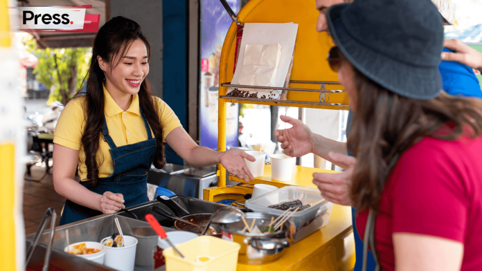 Hawker dealing with customer