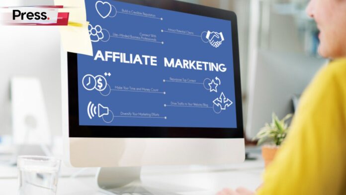 Photo of a woman using a PC with the word 'affiliate marketing' on the screen, representing a new affiliate marketing disciple